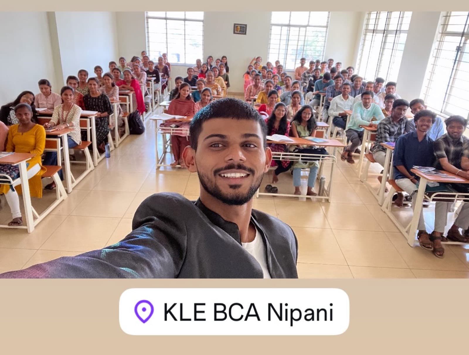 Akash Jadhav with a full classroom of BCA students at KLE BCA College, Nipani